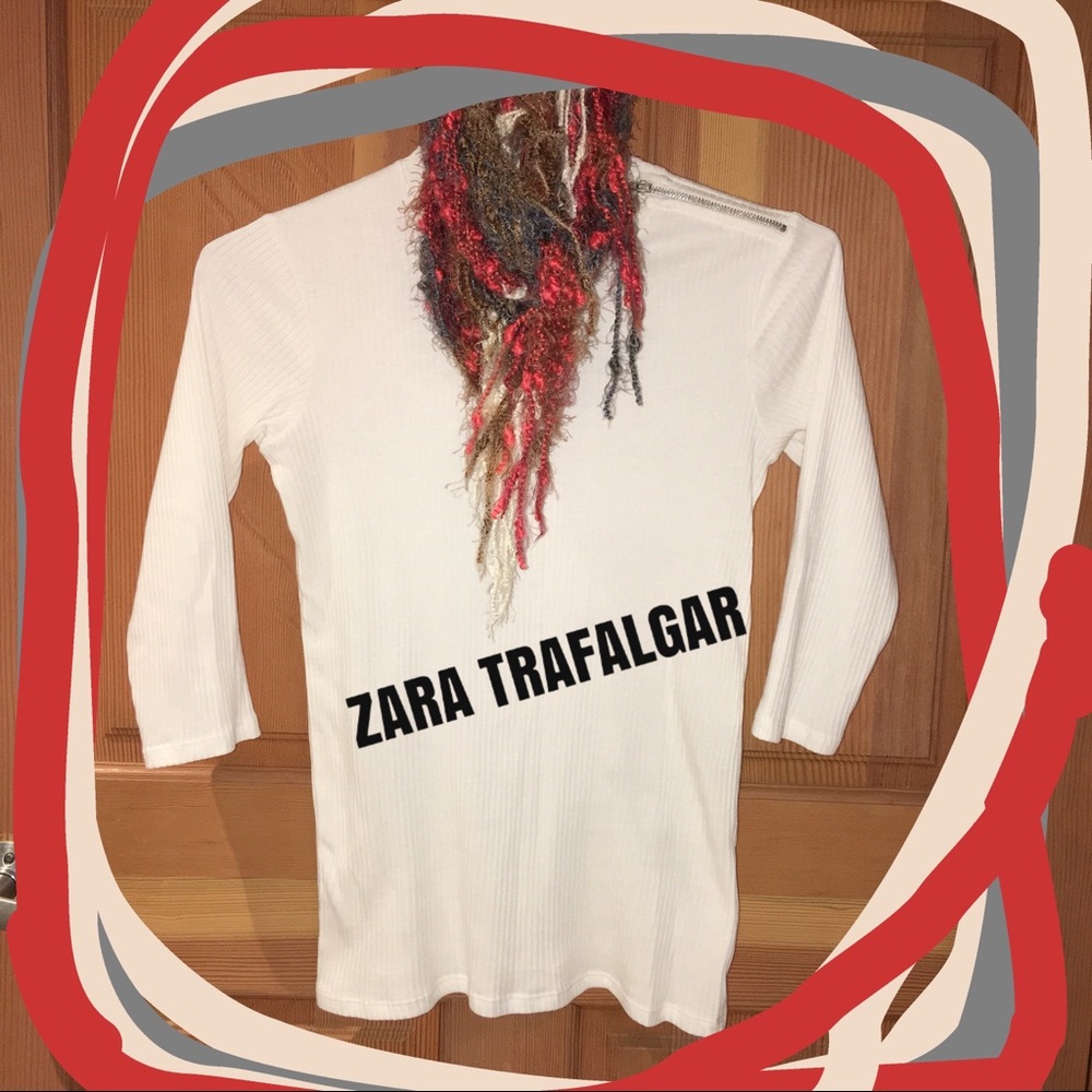 Add PIZAZZ to your look w/ a shoulder-zippered top